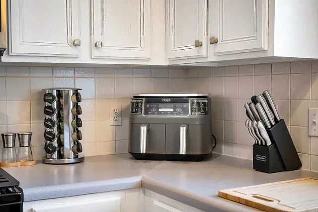 a kitchen with appliances and cabinets