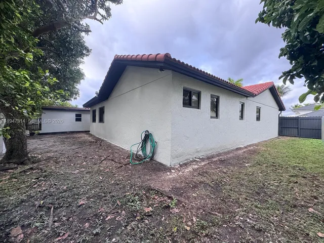 a house with trees in the background