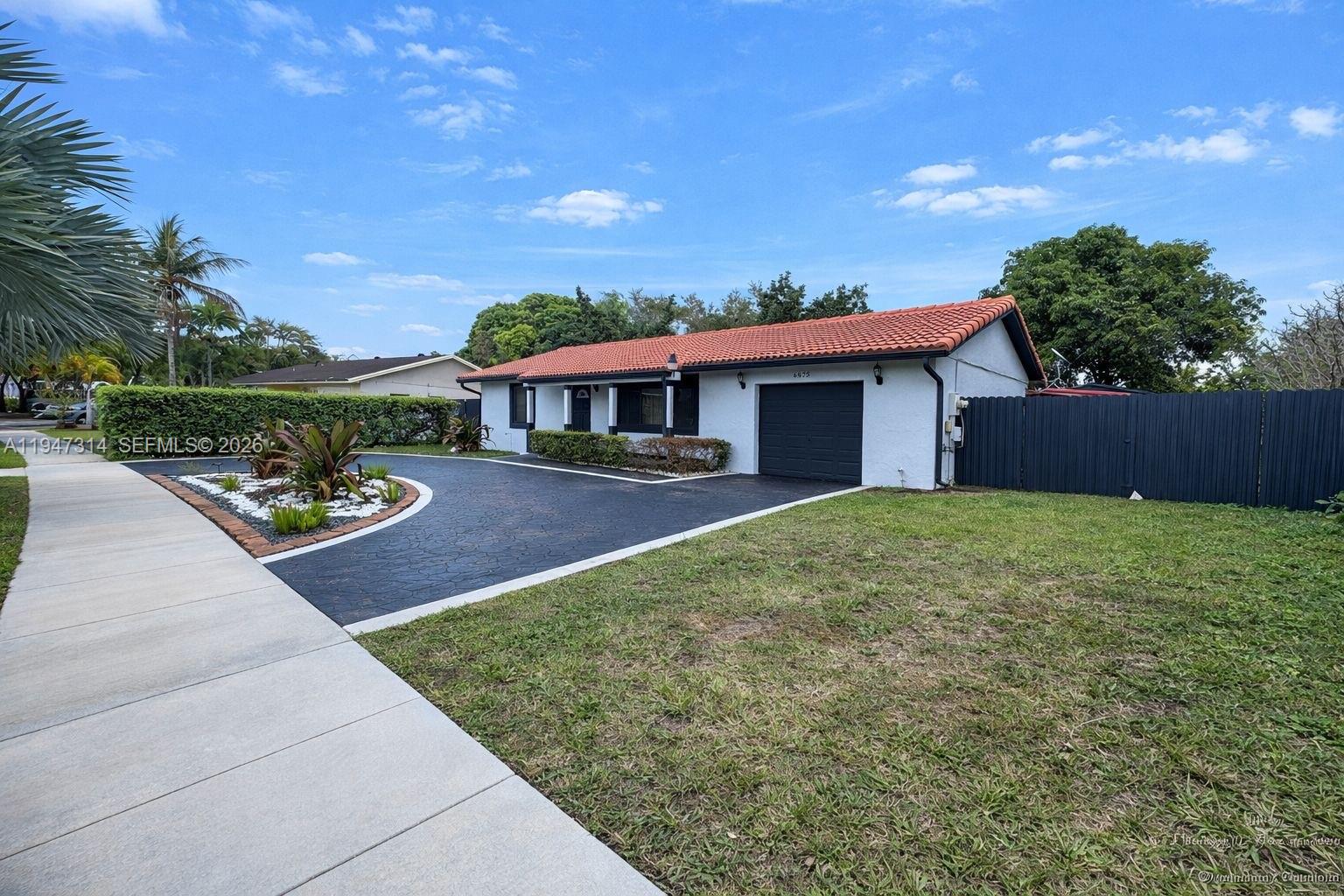 6875 Southwest 148th Court Miami, FL 33193 - Photo 3 of 16 a view of a patio with a table and chairs