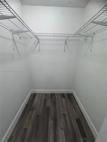 a view of a room with racks on the wall