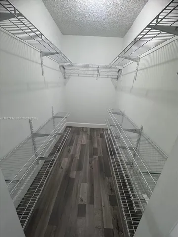 a view of a room with racks on the wall