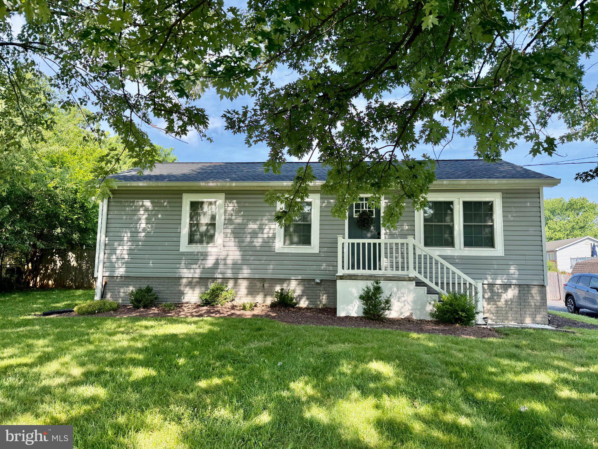 Charming home with lush greenery.