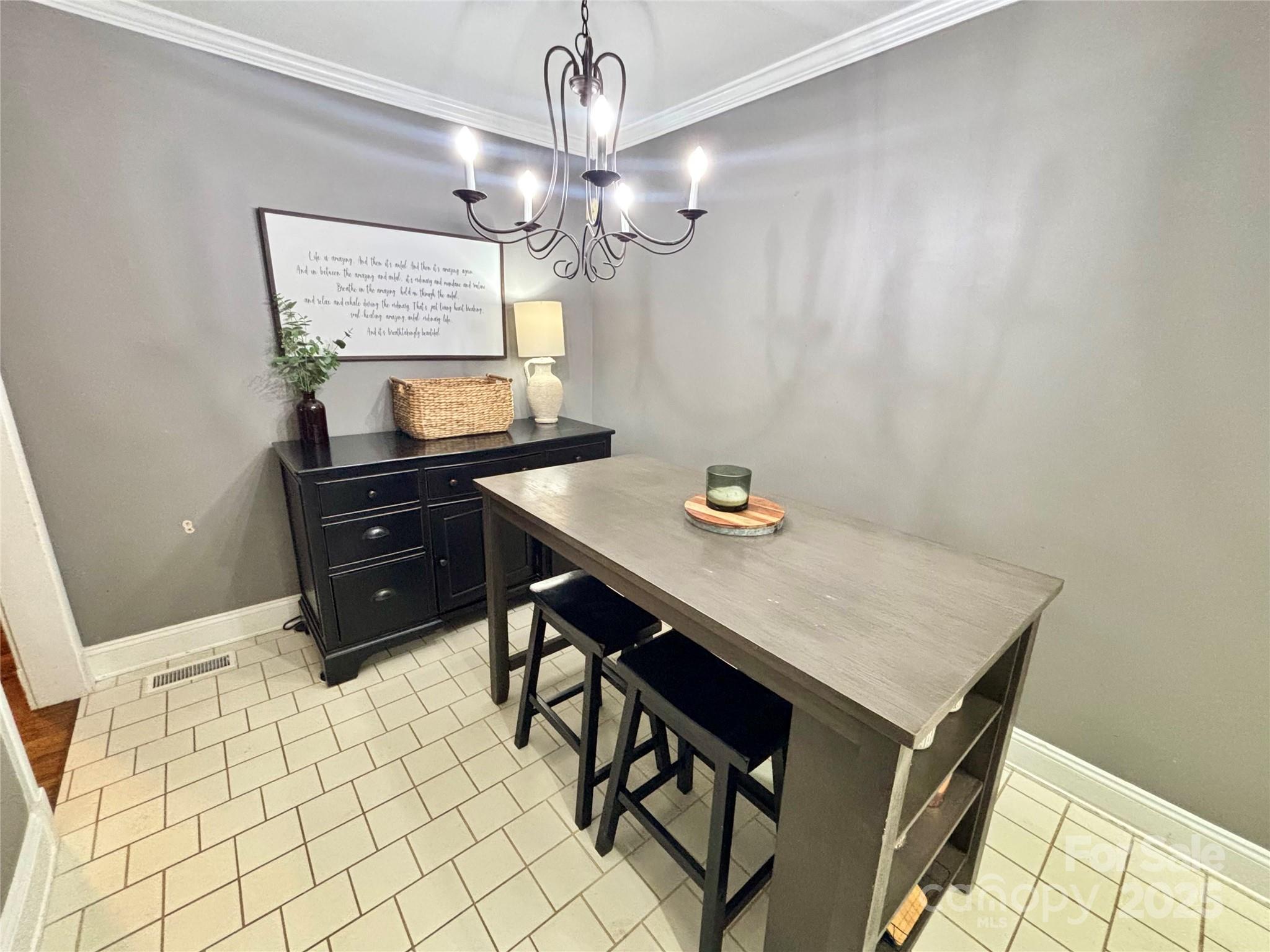 707 West Barr Street Lancaster, SC 29720 - Photo 18 of 43 a view of a workspace with furniture and chandelier