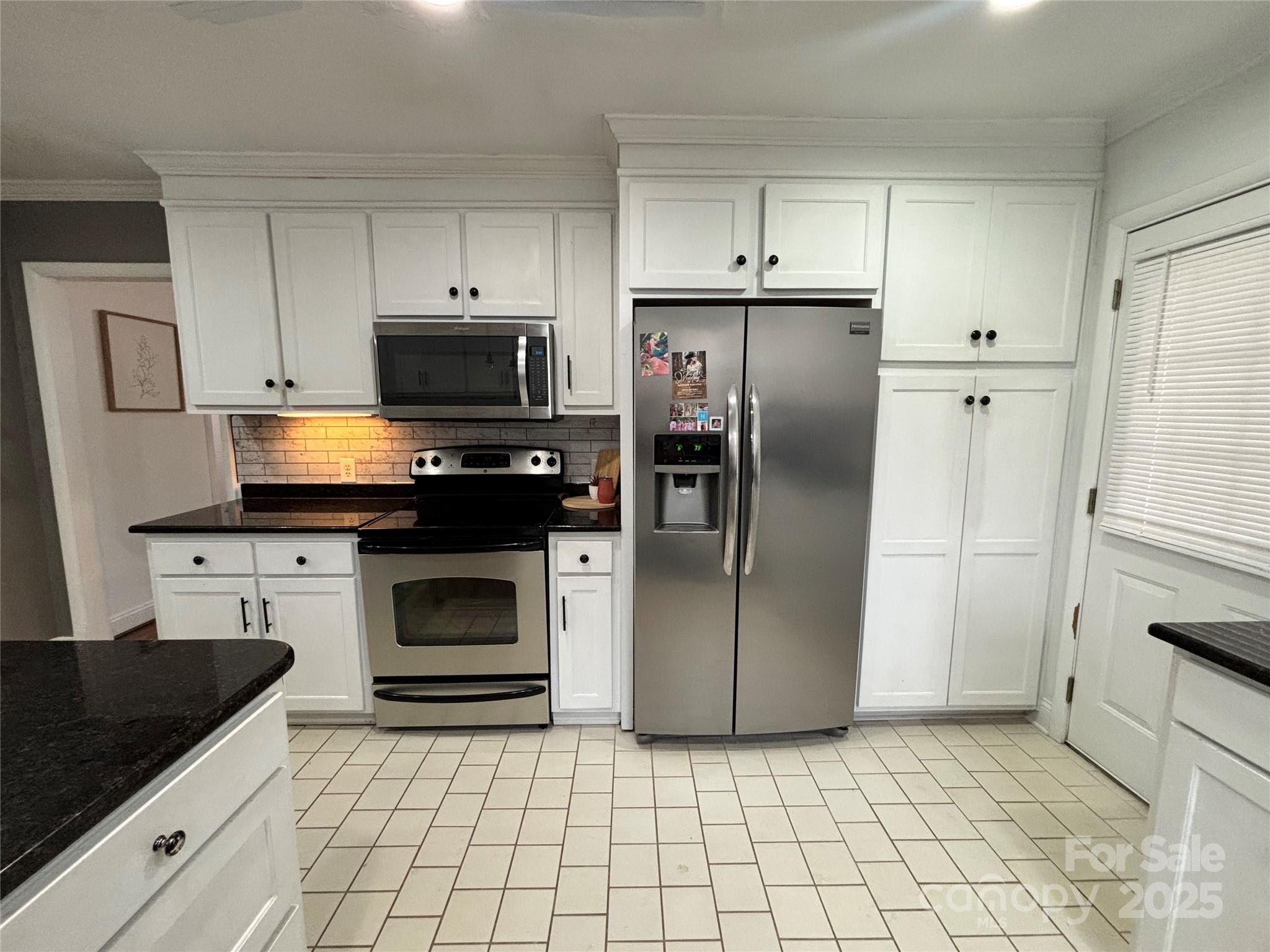 707 West Barr Street Lancaster, SC 29720 - Photo 24 of 43 a kitchen with a refrigerator stove and microwave