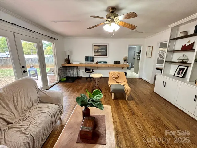 a living room with furniture or couch and a bookshelf