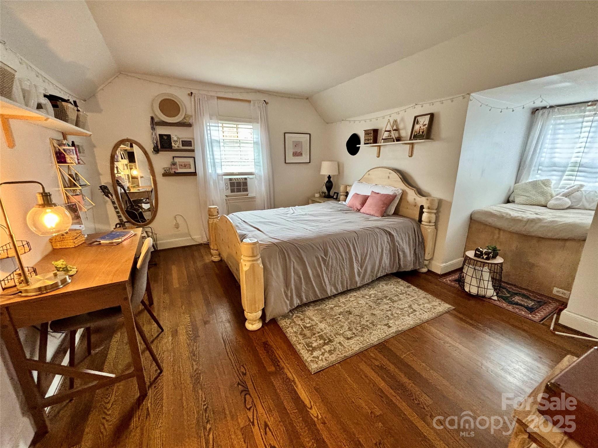 707 West Barr Street Lancaster, SC 29720 - Photo 34 of 43 a bedroom with a bed a mirror and desk