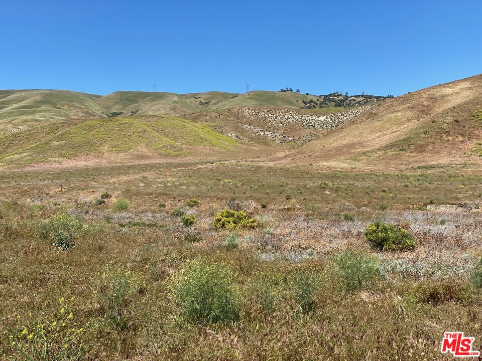 47330 Zenobia Road Lebec, CA 93243 - Photo 3 of 4 a view of a mountain range in a cloudy sky
