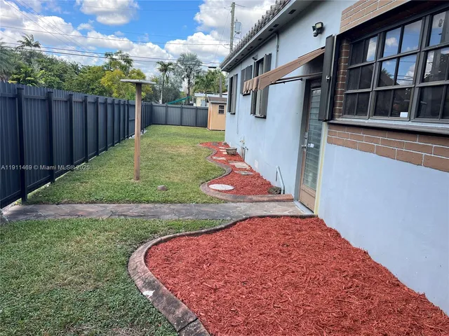 a view of a backyard with a tub