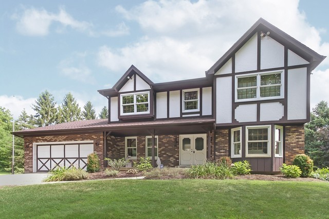 42W930 McDonald Road Elgin, IL 60124 - Photo 1 of 20 a front view of a house with garden