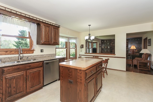 42W930 McDonald Road Elgin, IL 60124 - Photo 6 of 20 a kitchen with a sink stove and cabinets