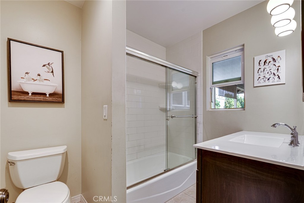 3513 Gondar Avenue Long Beach, CA 90808 - Photo 18 of 30 a bathroom with a toilet sink and mirror
