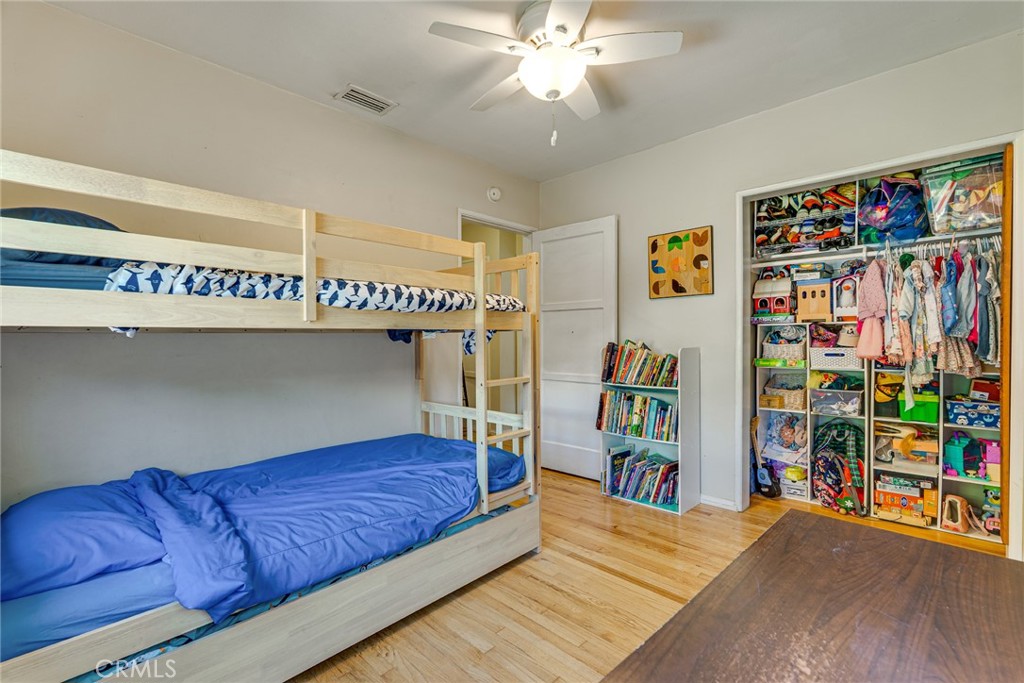 3513 Gondar Avenue Long Beach, CA 90808 - Photo 20 of 30 a living room with lots of furniture and a book shelf