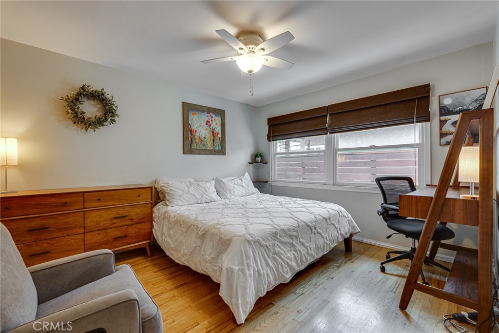3513 Gondar Avenue Long Beach, CA 90808 - Photo 22 of 30 a bedroom with a bed and a chandelier