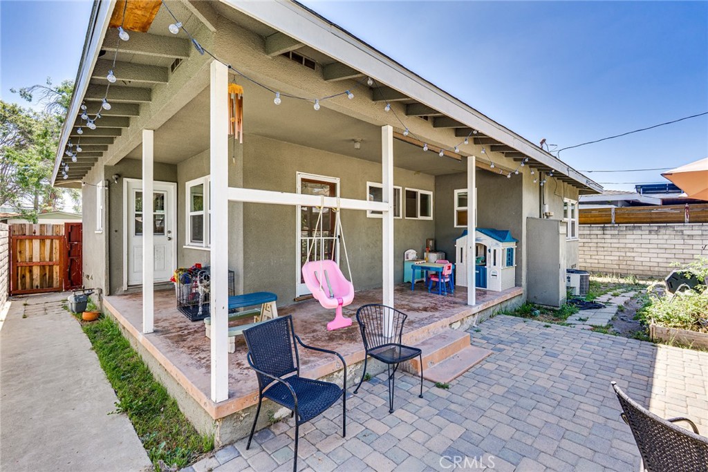 3513 Gondar Avenue Long Beach, CA 90808 - Photo 26 of 30 a front view of a house with outdoor seating and flowers