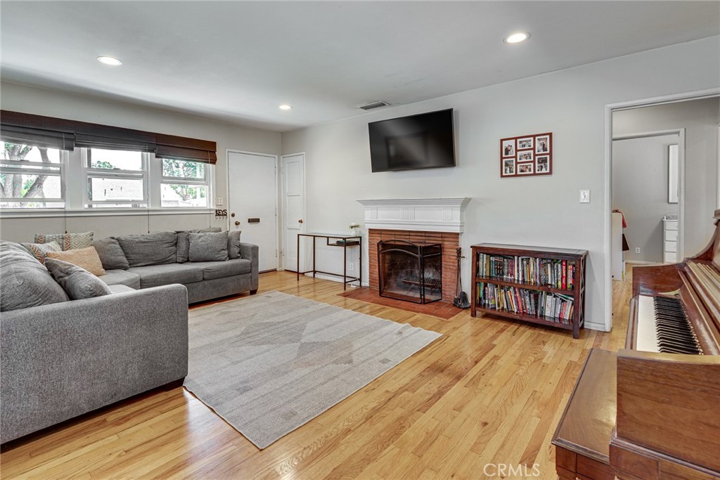 3513 Gondar Avenue Long Beach, CA 90808 - Photo 7 of 30 a living room with furniture and a fireplace