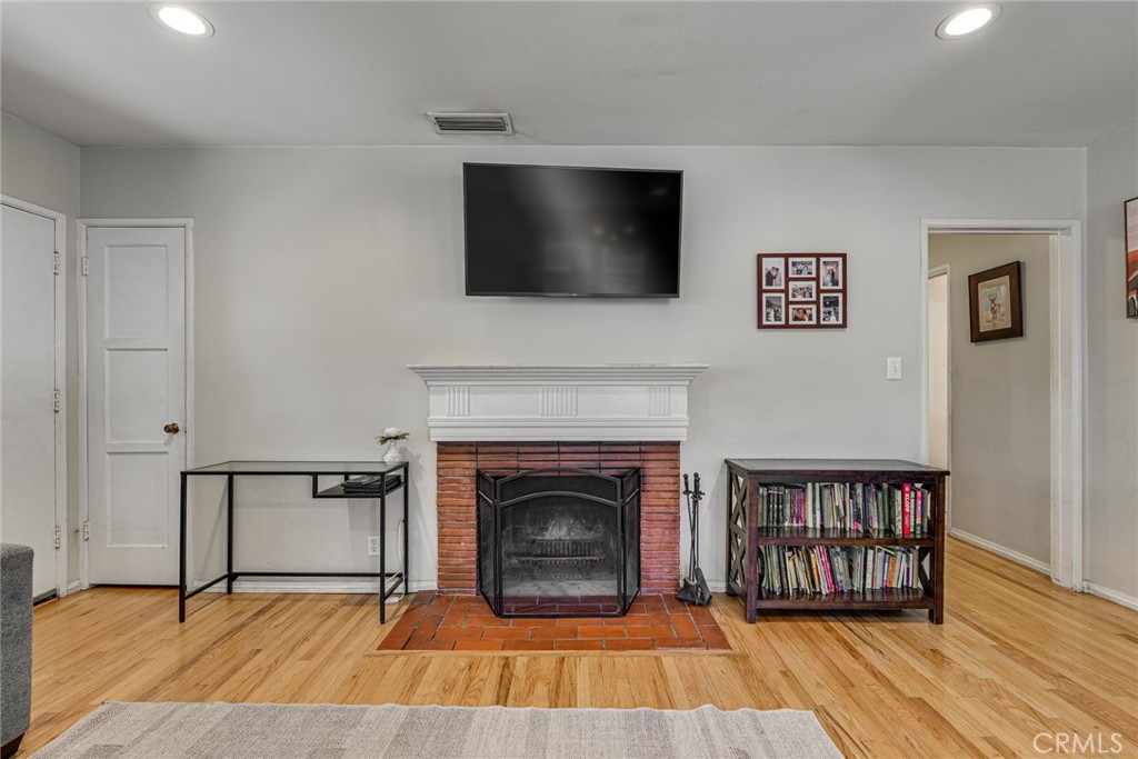 3513 Gondar Avenue Long Beach, CA 90808 - Photo 8 of 30 a living room with furniture and a fireplace