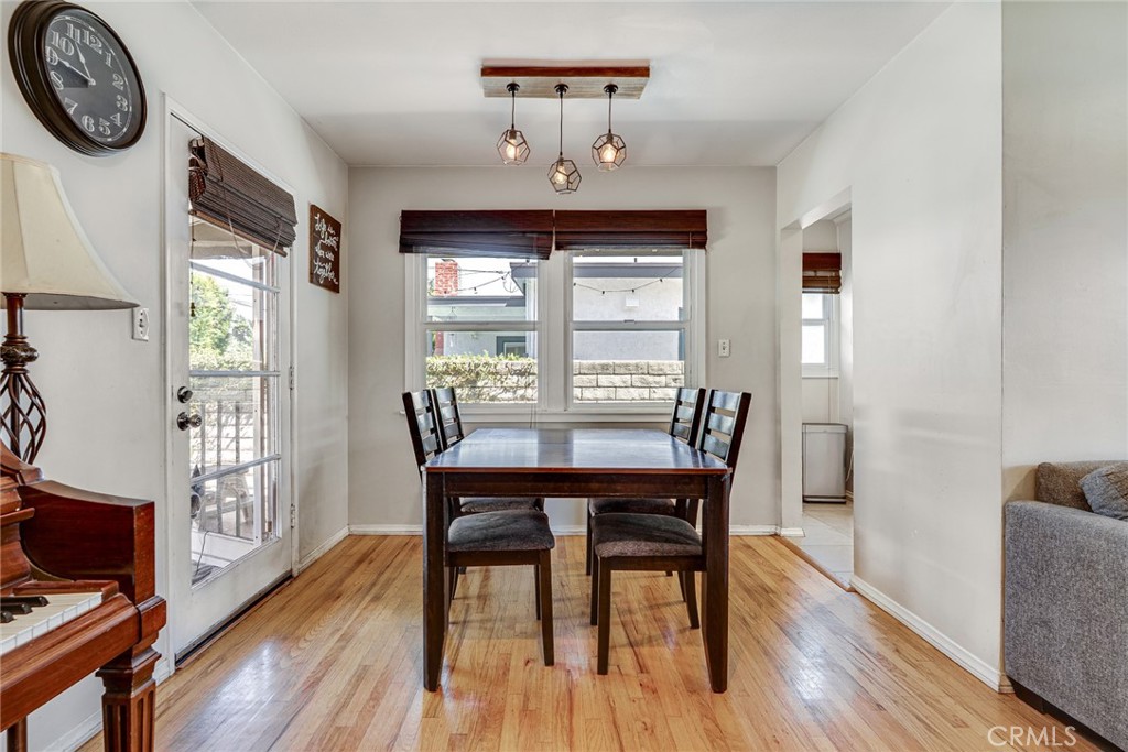 3513 Gondar Avenue Long Beach, CA 90808 - Photo 9 of 30 a view of a dining room with furniture window and wooden floor