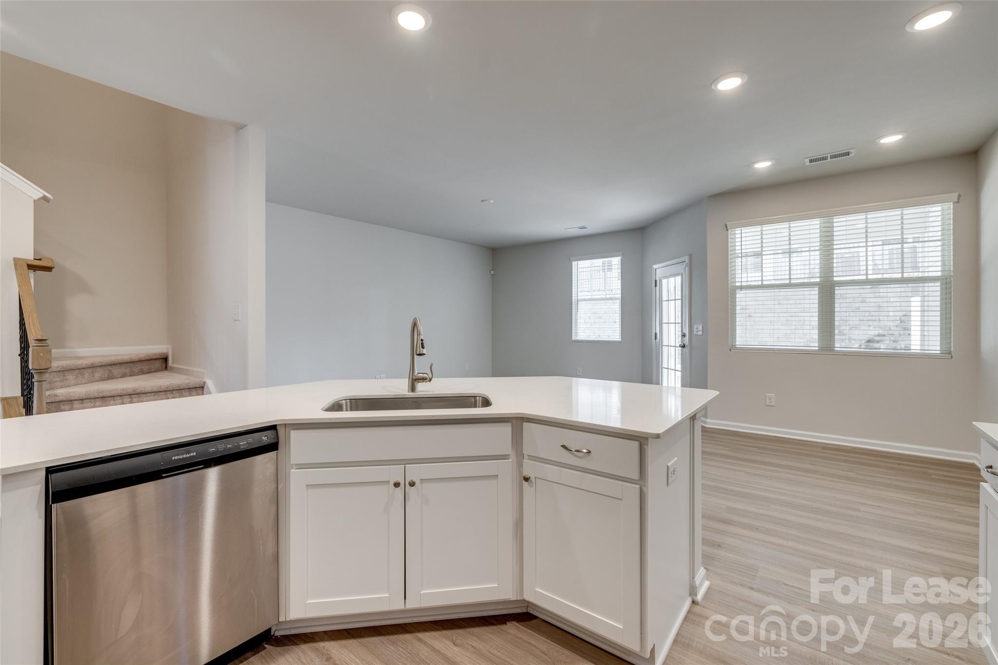 807 Gable Oak Lane Fort Mill, SC 29708 - Photo 8 of 39 a kitchen with a sink a window and cabinets