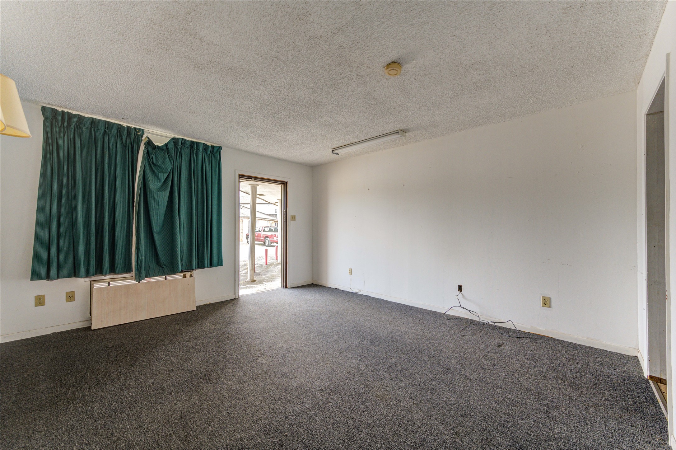 4602 Avenue H Rosenberg, TX 77471 - Photo 16 of 42 a view of an empty room with windows