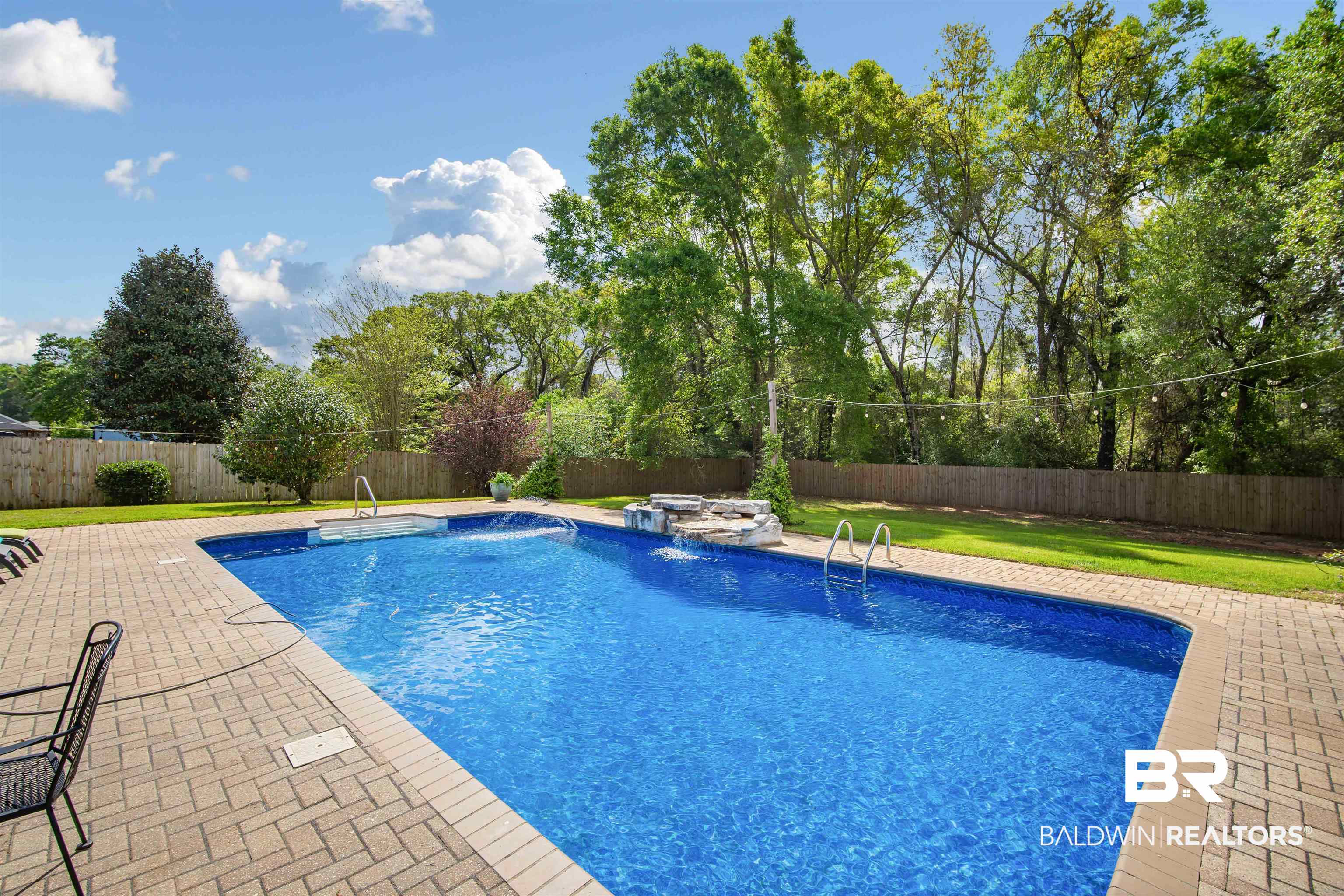 10713 Rigby Drive Mobile, AL 36695 - Photo 31 of 35 View of pool with a fenced backyard and patio surround