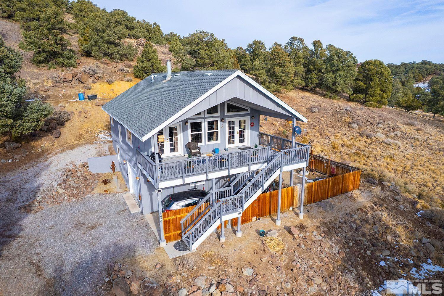 2470 Cartwright Road Reno, NV 89521 - Photo 1 of 29 aerial view of a house with a big yard and large trees