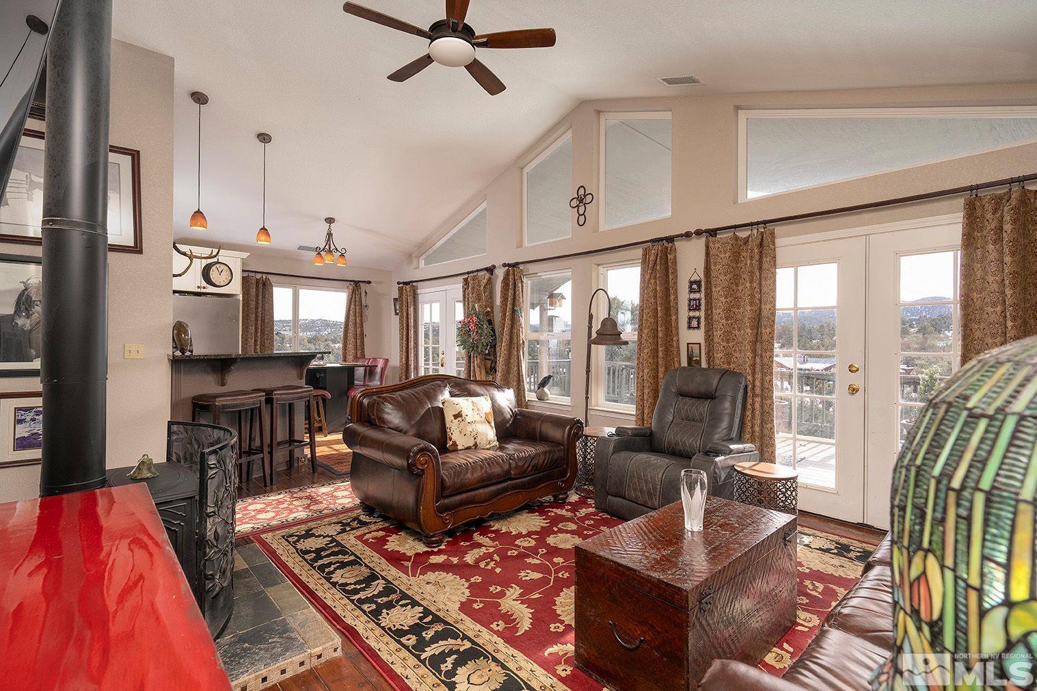 2470 Cartwright Road Reno, NV 89521 - Photo 11 of 29 a living room with furniture and a chandelier