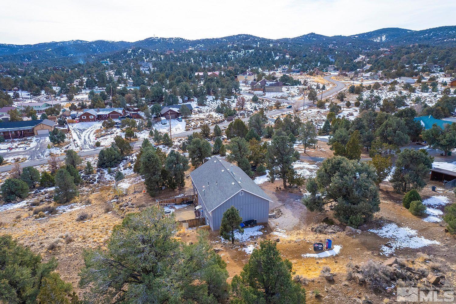 2470 Cartwright Road Reno, NV 89521 - Photo 3 of 29 an aerial view of a house with a mountain in the background