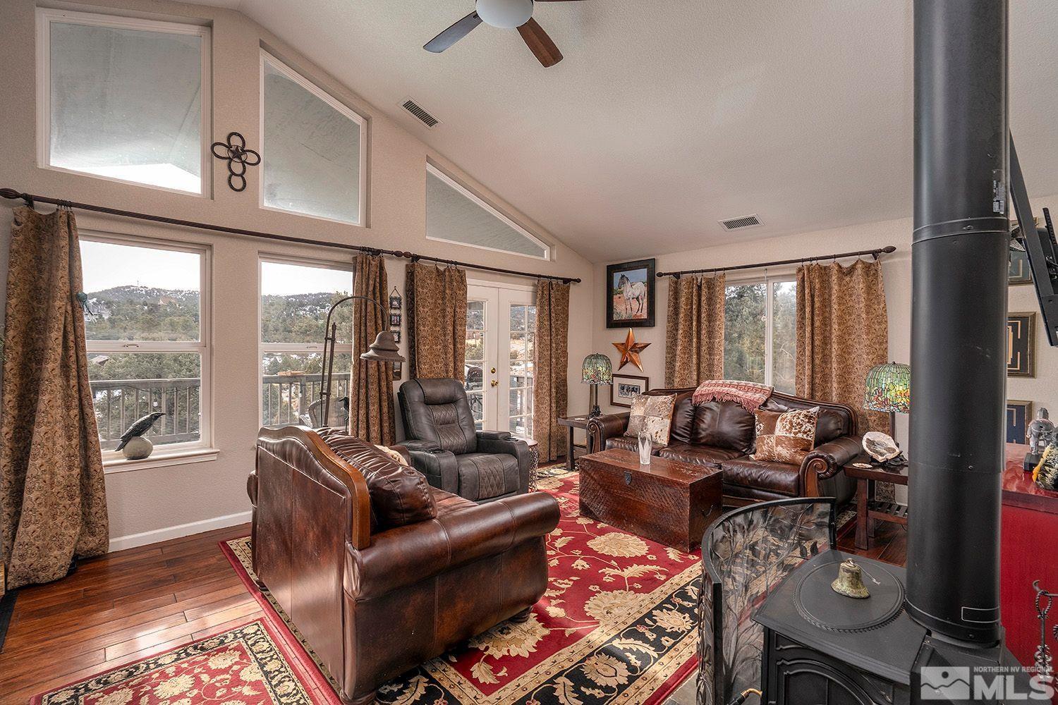 2470 Cartwright Road Reno, NV 89521 - Photo 7 of 29 a living room with furniture and a floor to ceiling window