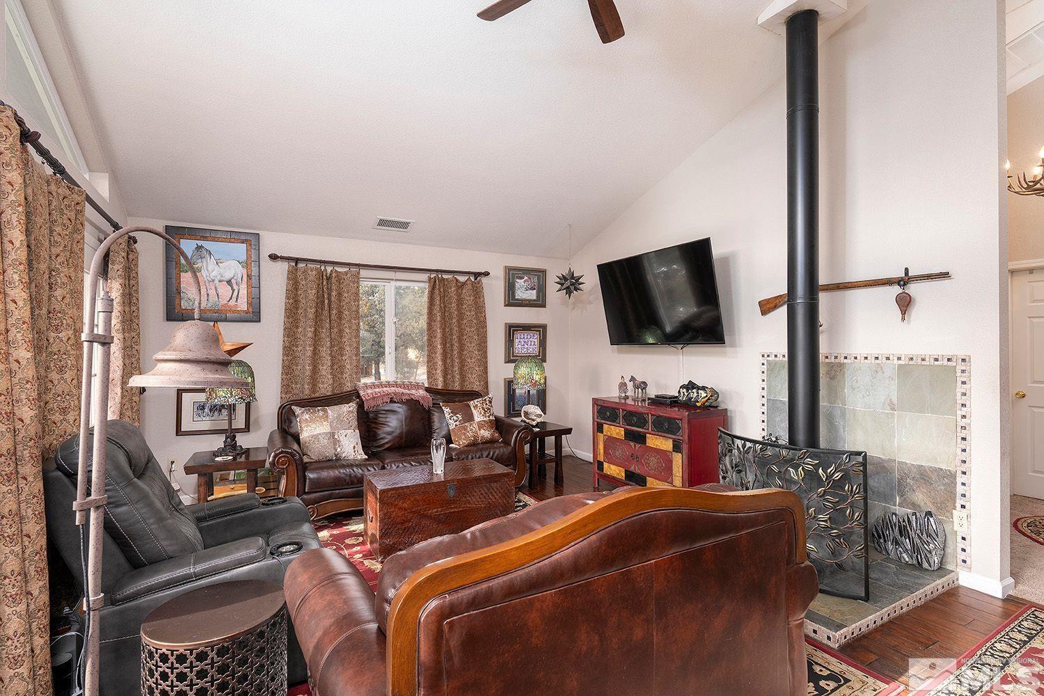 2470 Cartwright Road Reno, NV 89521 - Photo 8 of 29 a room with furniture a flat screen tv and a window