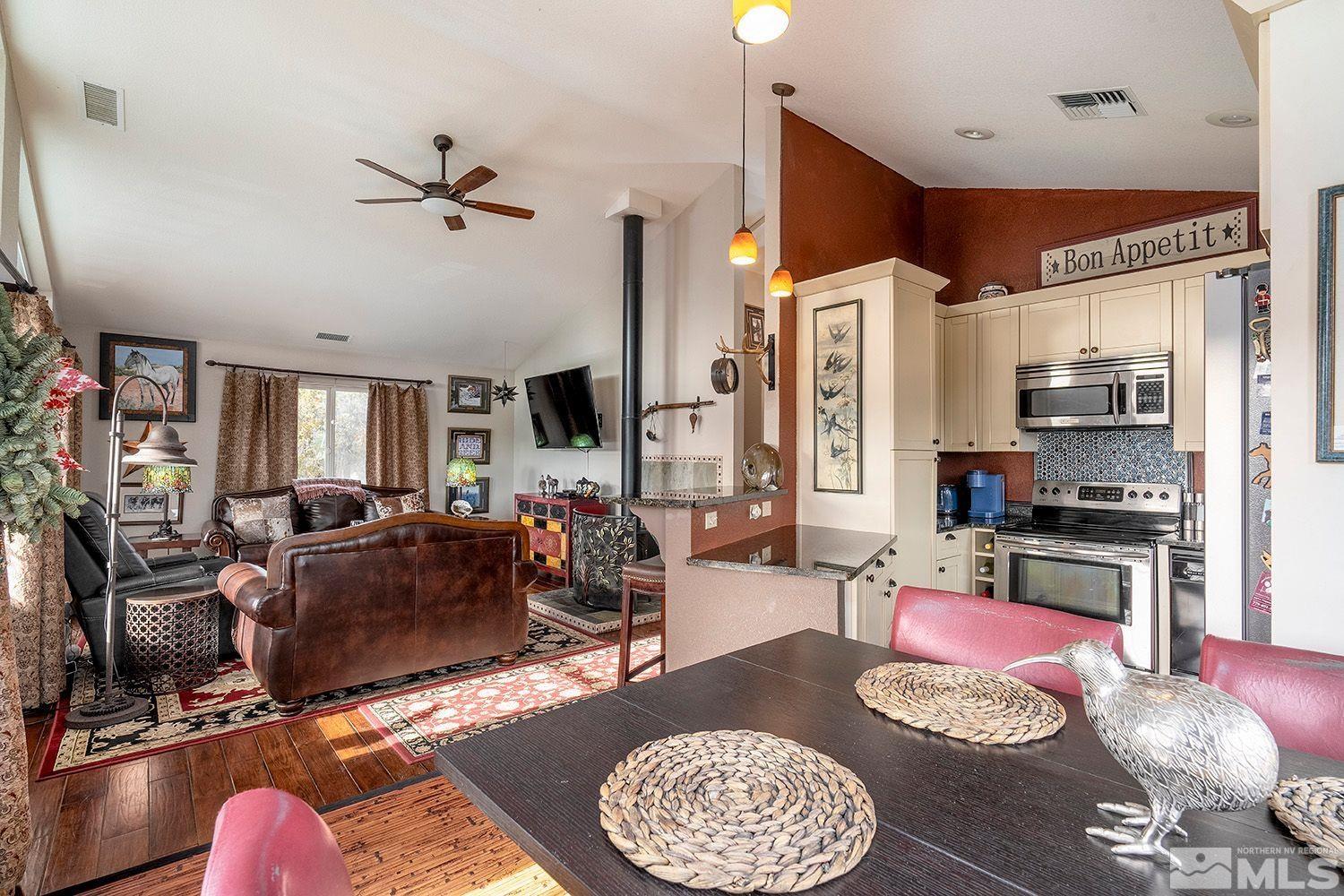 2470 Cartwright Road Reno, NV 89521 - Photo 10 of 29 a living room with furniture and a kitchen