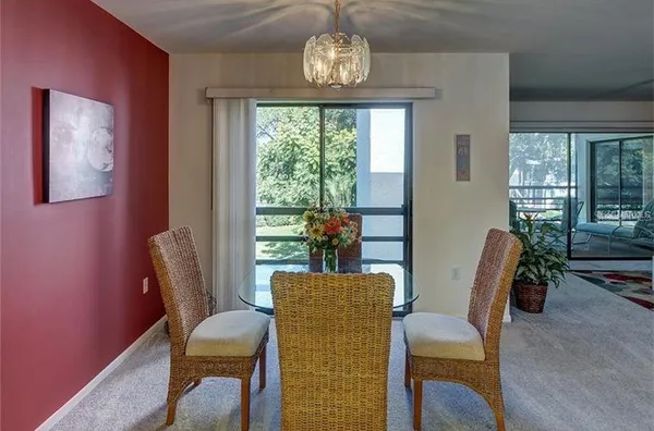 a view of a dining room with furniture window and outside view