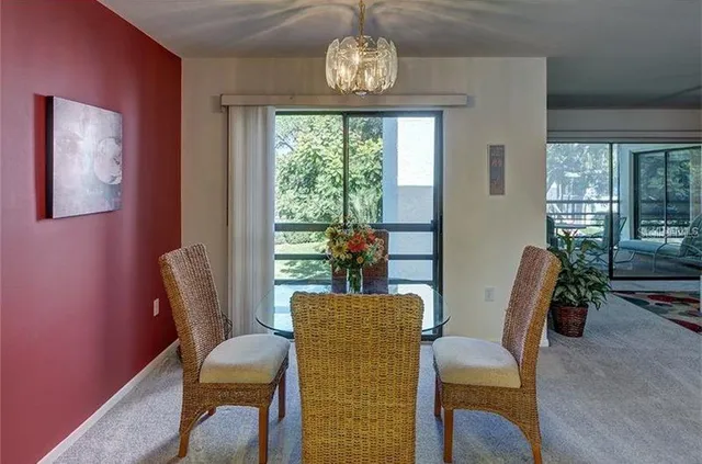a view of a dining room with furniture window and outside view