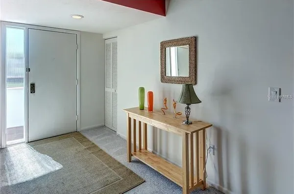 a bedroom with a bed and a desk