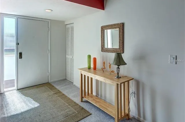 a bedroom with a bed and a desk