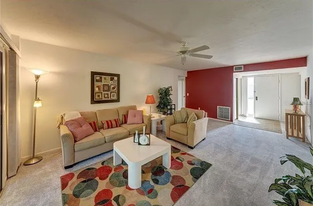 a living room with furniture and a rug
