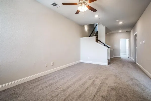 a kitchen with stainless steel appliances granite countertop a stove a microwave and a sink