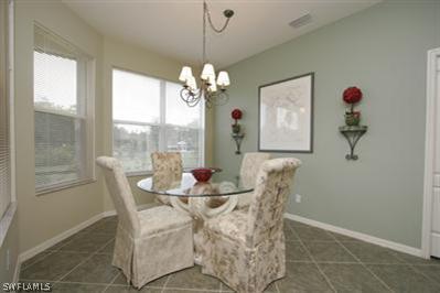 15057 Balmoral Loop Fort Myers, FL 33919 - Photo 4 of 10 a view of a dining room with furniture window and outside view