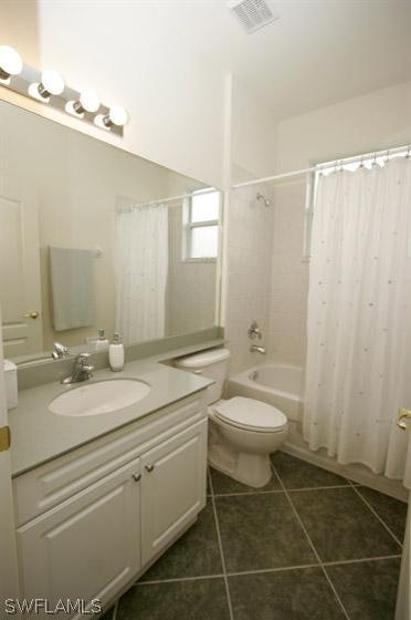 15057 Balmoral Loop Fort Myers, FL 33919 - Photo 7 of 10 a bathroom with a granite countertop sink a mirror and a toilet