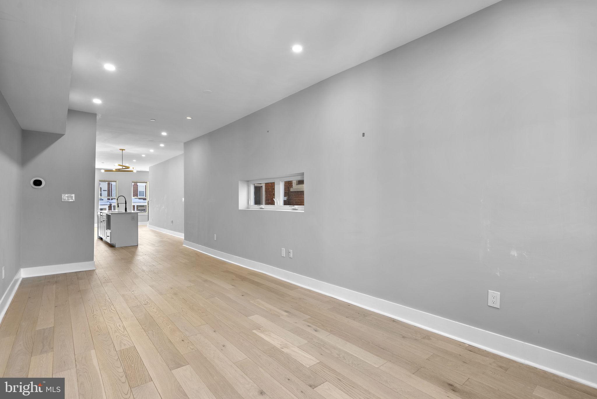 3572 13th Street Northwest, Unit 2 Washington, DC 20010 - Photo 16 of 36 a view of a hallway with wooden floor