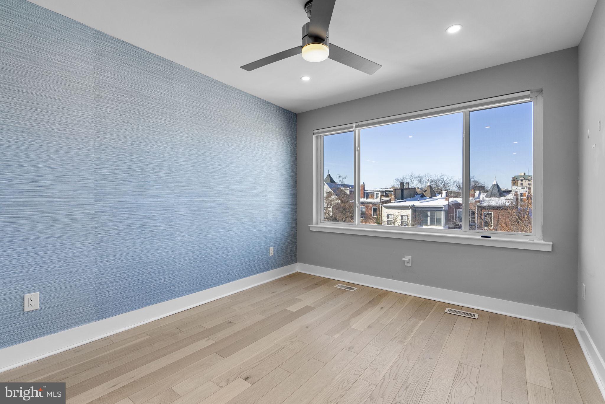 3572 13th Street Northwest, Unit 2 Washington, DC 20010 - Photo 18 of 36 wooden floor in an empty room with a window
