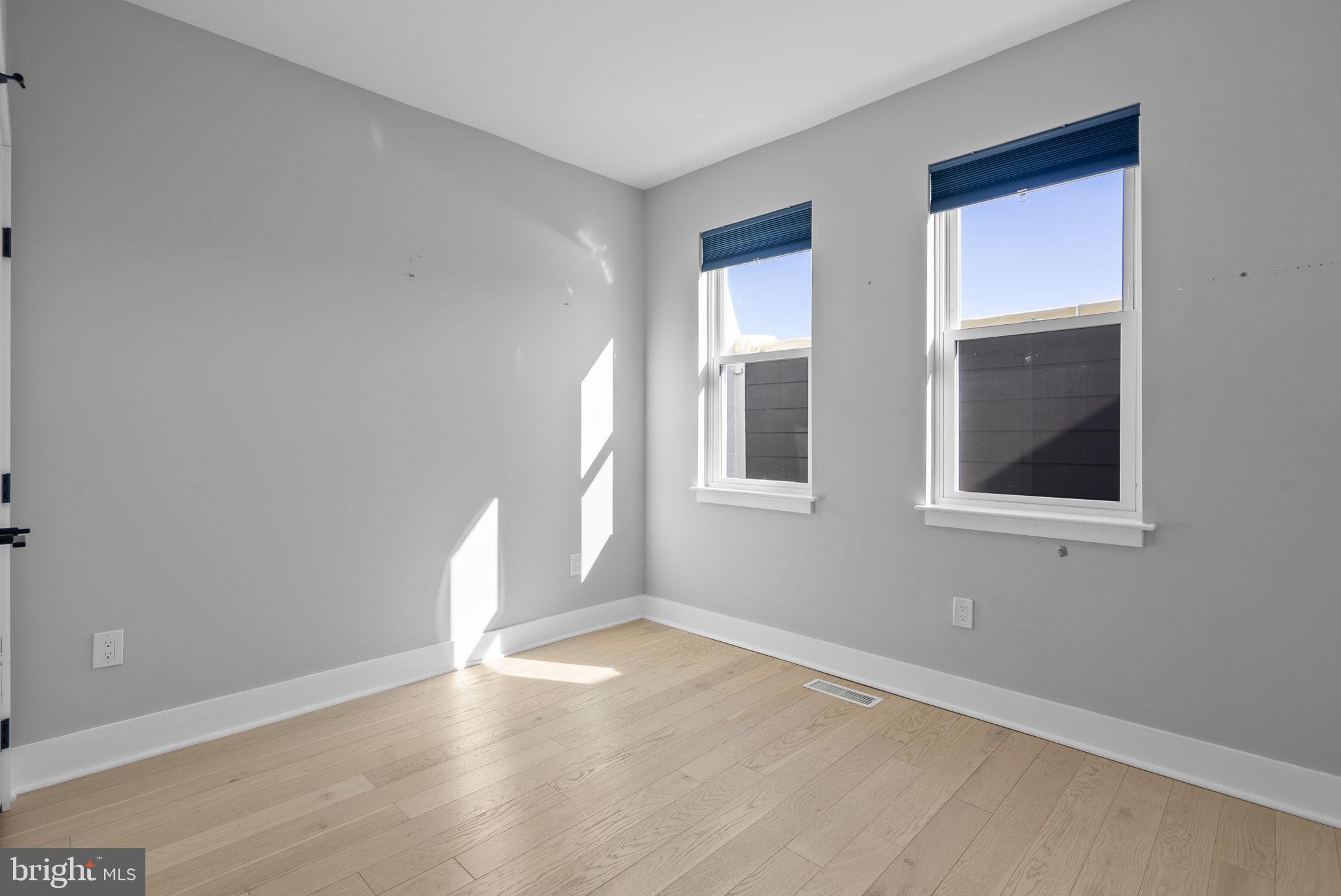 3572 13th Street Northwest, Unit 2 Washington, DC 20010 - Photo 22 of 36 an empty room with windows