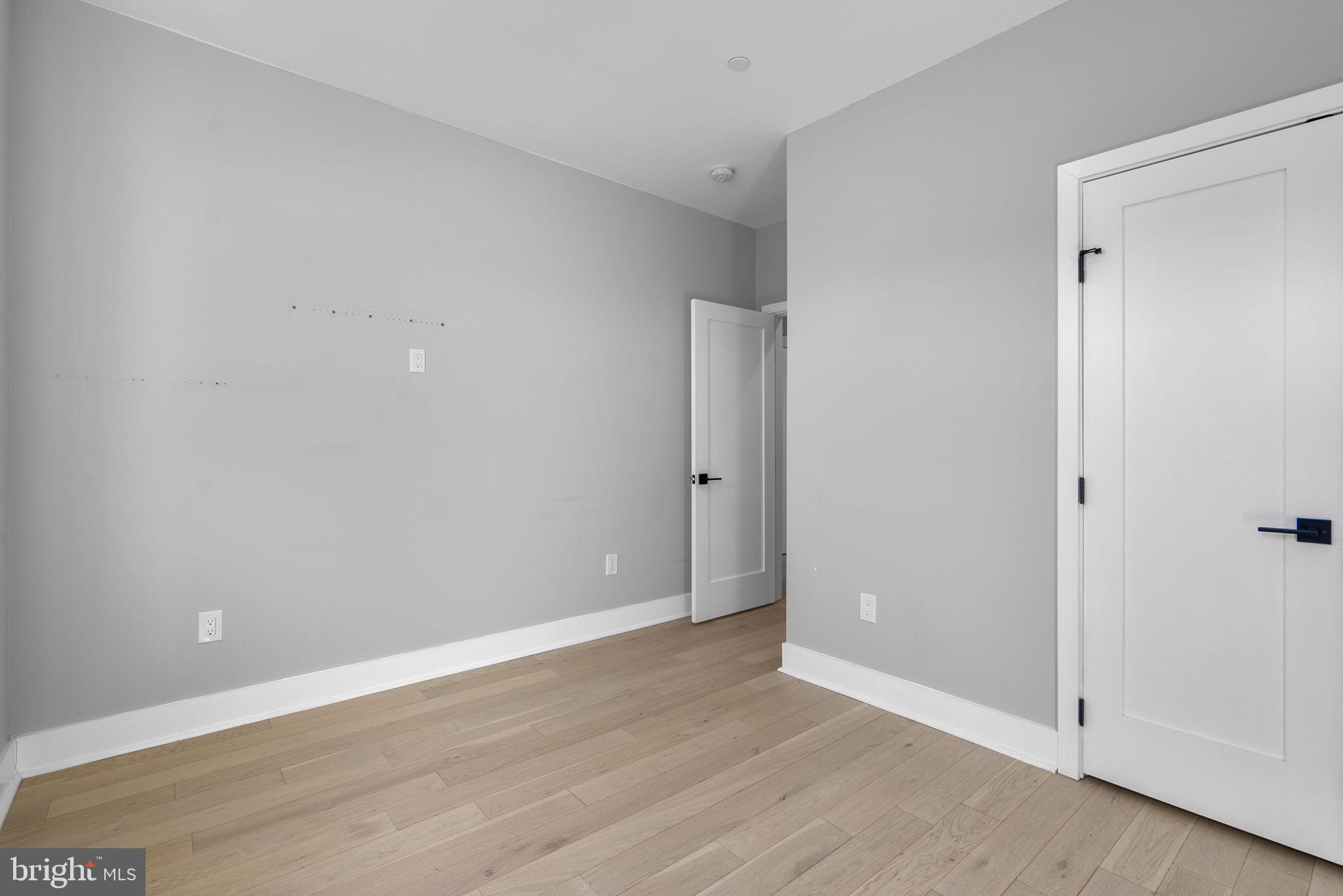 3572 13th Street Northwest, Unit 2 Washington, DC 20010 - Photo 23 of 36 a view of an empty room with wooden floor