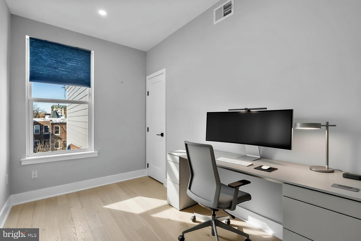 3572 13th Street Northwest, Unit 2 Washington, DC 20010 - Photo 24 of 36 a view of a workspace with furniture and a window
