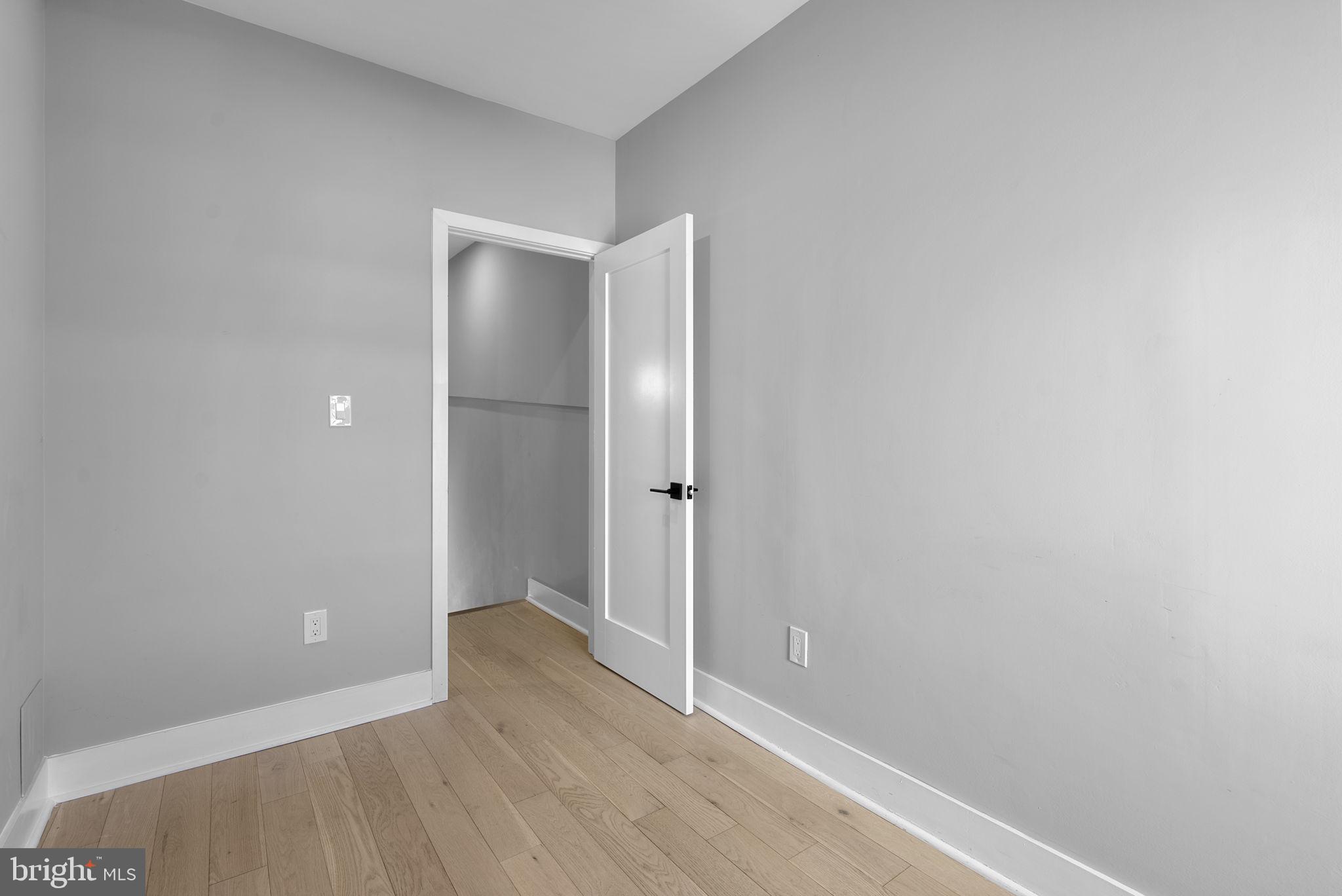 3572 13th Street Northwest, Unit 2 Washington, DC 20010 - Photo 26 of 36 a view of an empty room with wooden floor