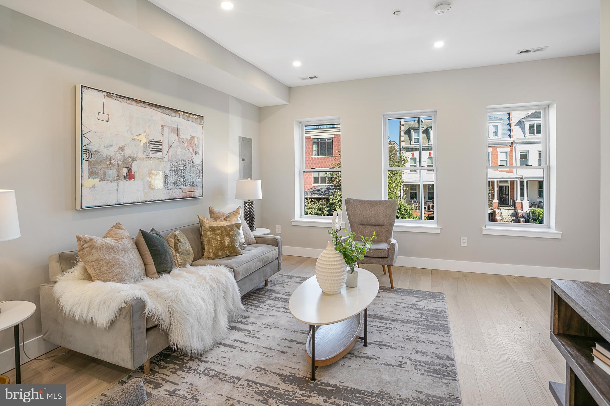 3572 13th Street Northwest, Unit 2 Washington, DC 20010 - Photo 3 of 9 a living room with furniture and windows