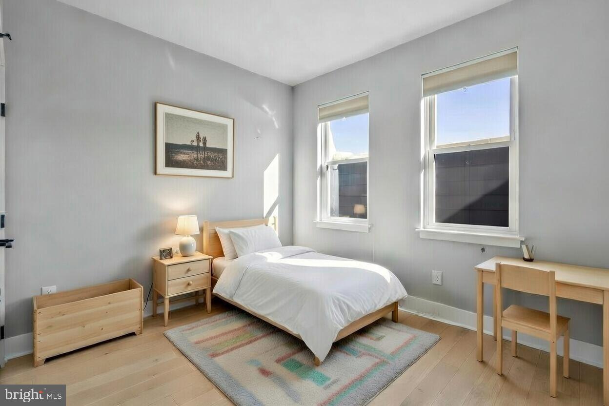 3572 13th Street Northwest, Unit 2 Washington, DC 20010 - Photo 5 of 36 a bedroom with a bed and a window