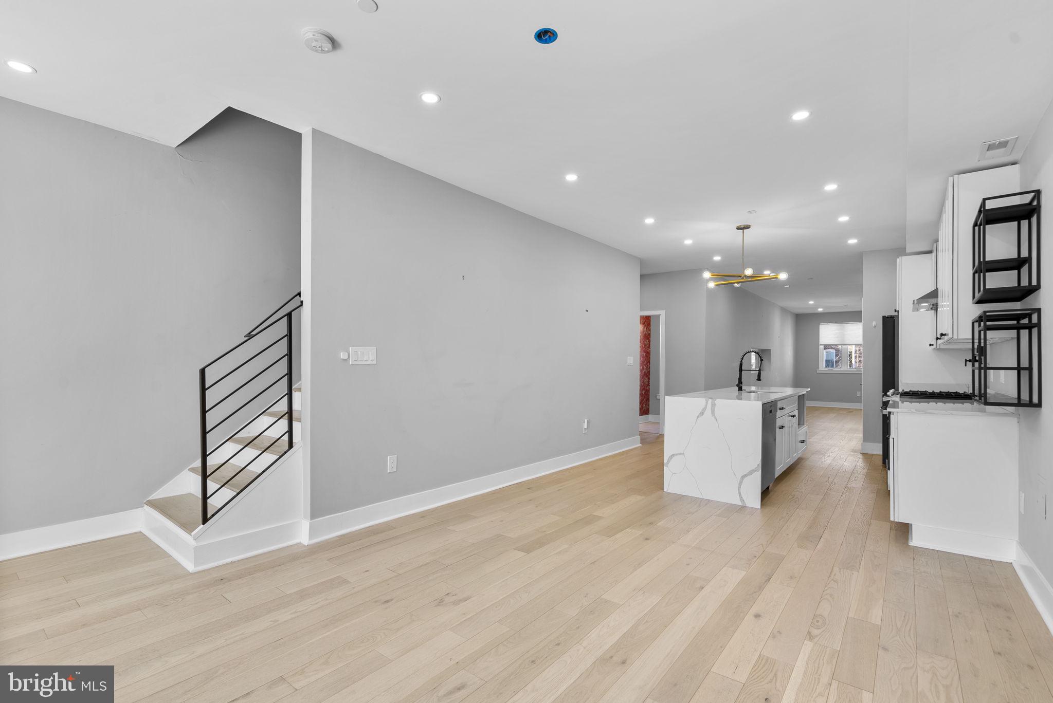 3572 13th Street Northwest, Unit 2 Washington, DC 20010 - Photo 9 of 36 a view of kitchen and living room with wooden floor