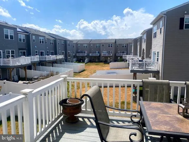 a view of a balcony with chairs