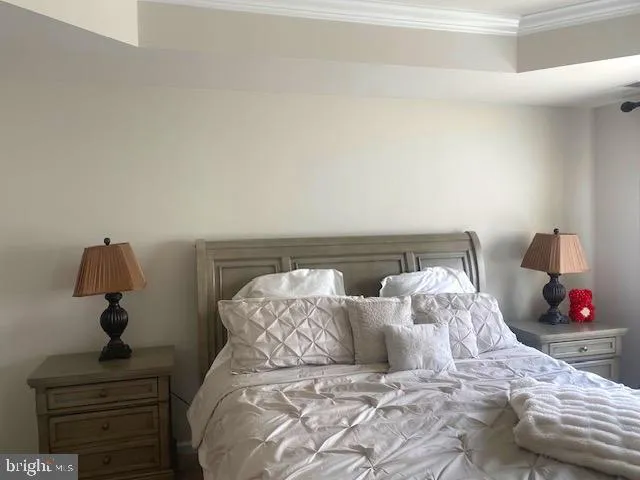 a bed sitting in a bedroom and lamp