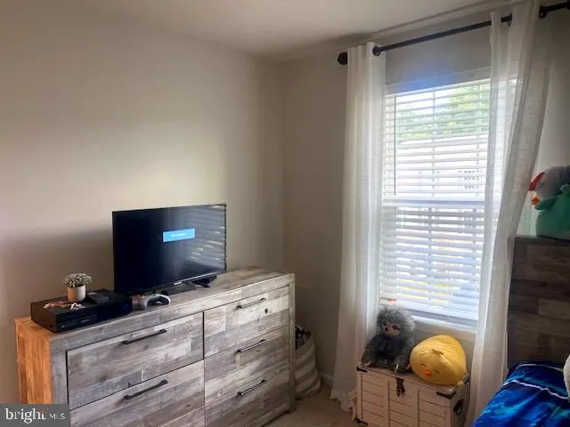 a room with furniture and flat screen tv